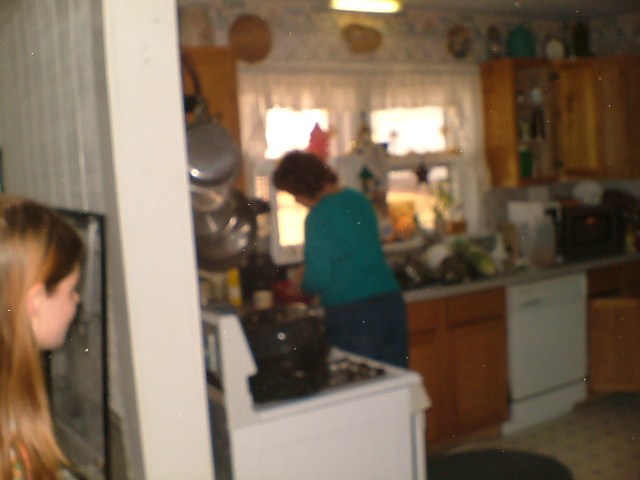 Pamela Derrickson watching Rose Derrickson fixing something Pamela Derrickson watching Rose Derrickson fixing something